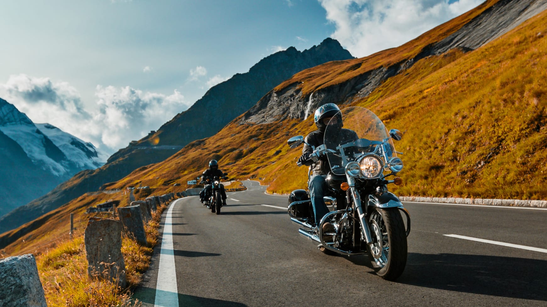 Two Motorcycles Driving On a Mountain Road