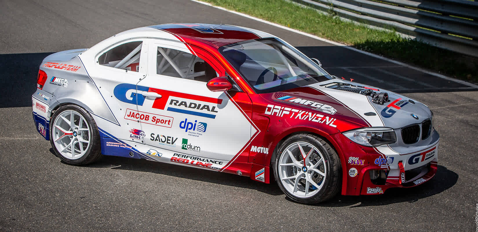 Racing car on track with GT Radial tires