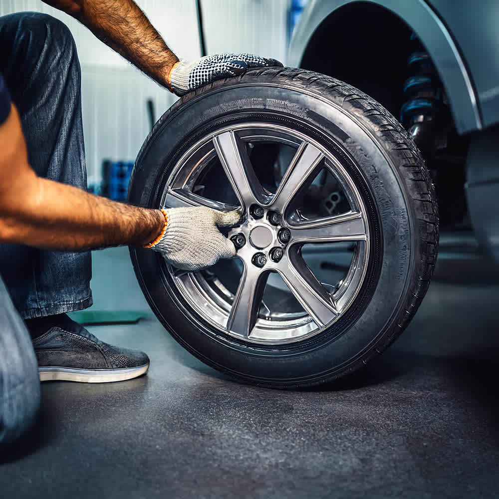 Mechanic checking tires