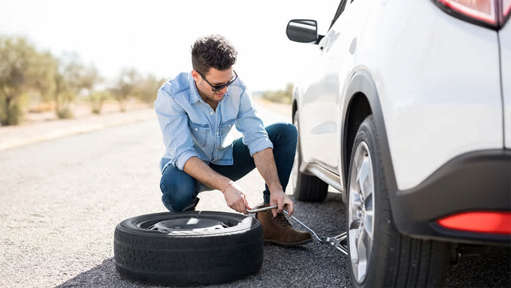 Man changing a flat tire