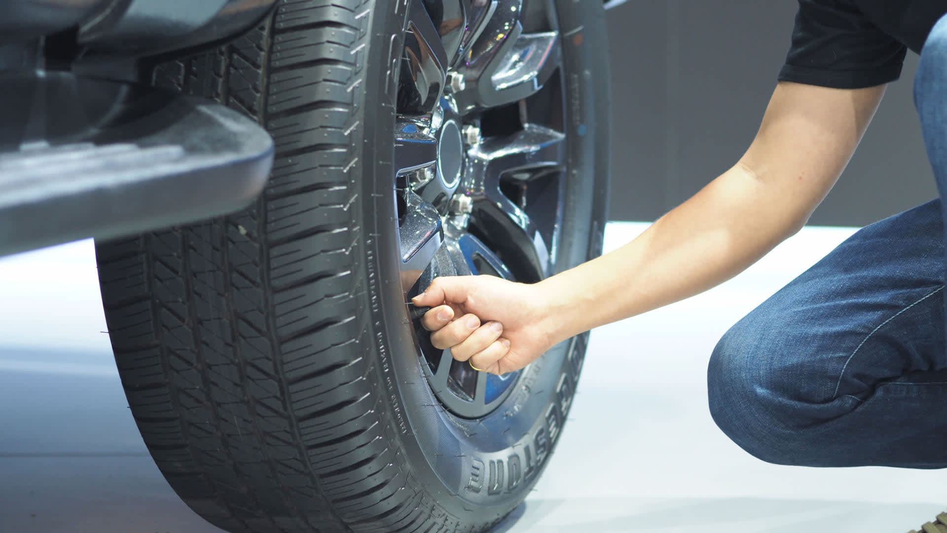 Man checking tire pressure