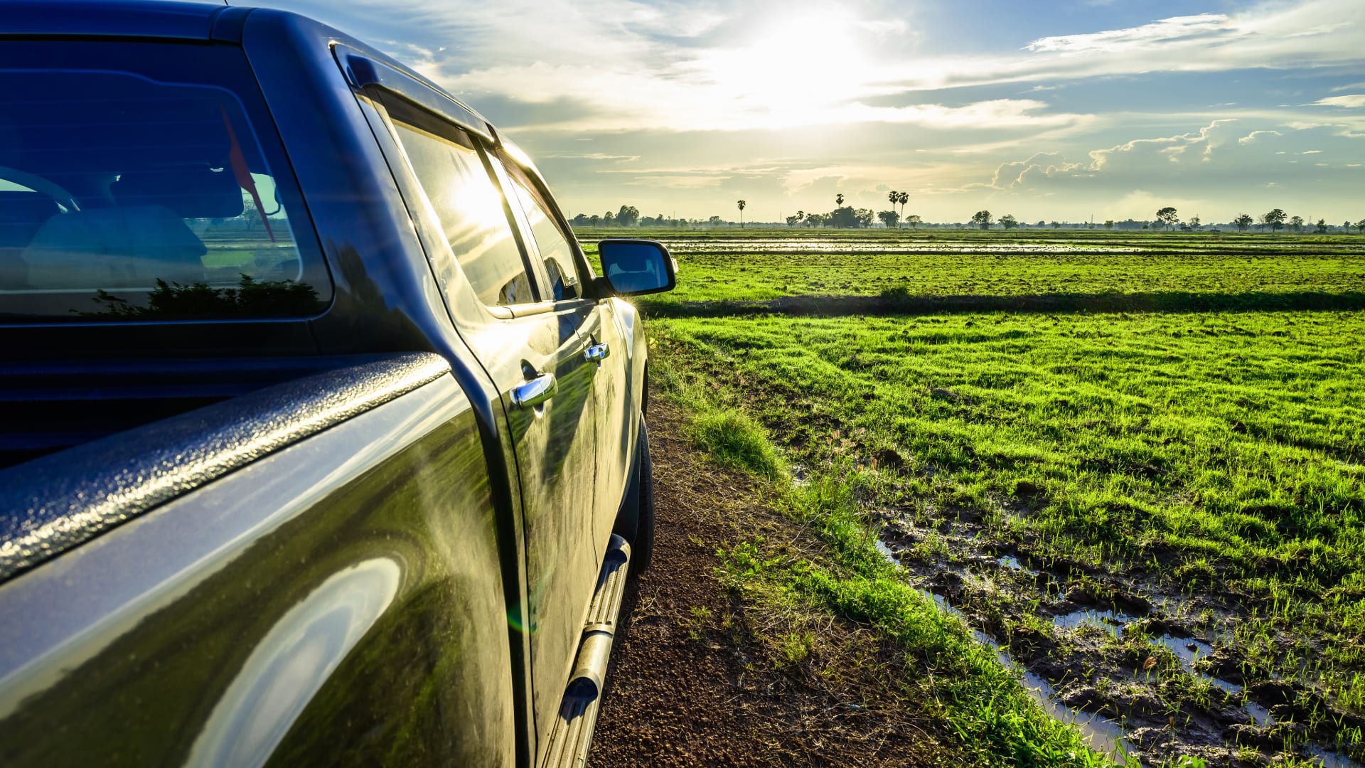 Atturo Trail Blade A/T tires on a pickup truck in a field